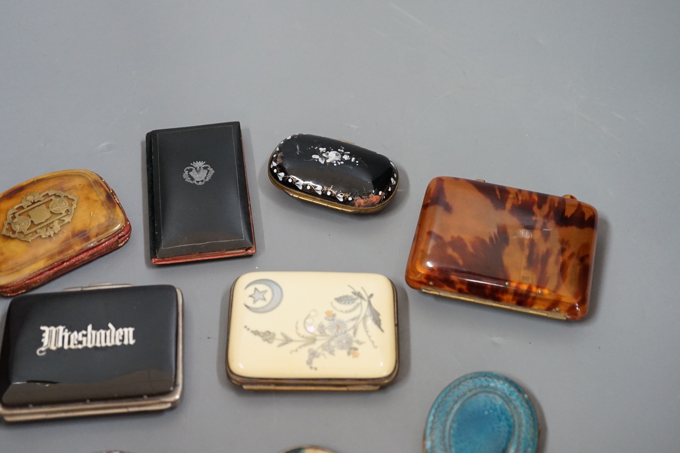 A mixed collection of enamel, tortoiseshell and other purses, a Chinese porcelain box and enamel topped box